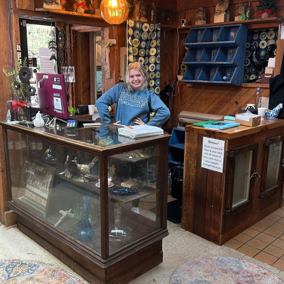 Antique shop staff at checkout counter